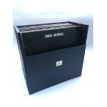 A record case containing various LPs, mostly compilations, to include ABBA, Elvis and The Beach Boys