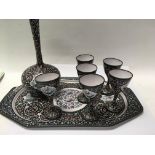 A Indian enamel tray with six matching cups and va