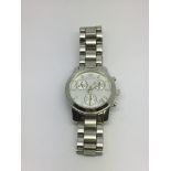 A Michael Kors silver tone ladies watch with subsi