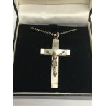 A silver and mother of pearl crucifix on chain. Si