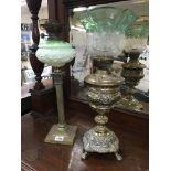 An ornate brass oil lamp plus a brass corintihum c