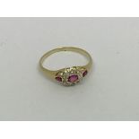 A fine 18ct gold ring set with Ruby’s and diamonds