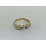 A 14ct gold ring set with blue and white stones. S