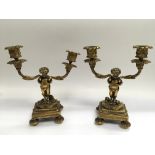 A pair of Victorian ormolu two branch figural cand