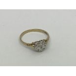 A 9ct gold ring set with heart shaped diamond clus