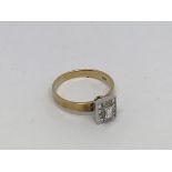 A 14ct gold ring set with baguette and princess cu