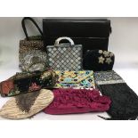 A collection of beaded bags, purses, shawls, scarv