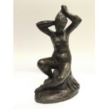 A modern bronze study of a female nude, approx 26.5cm.