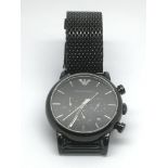An Armani gents watch with black face and black me