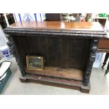 A carved fronted oak bookcase 124 x 105cm.