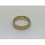 A 14ct gold full eternity ring set with 16 diamond