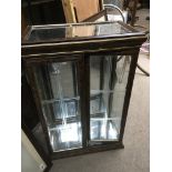 A glass display cabinet, approx 55cm x 81cm x 32cm