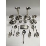 A collection of silver items including candlestick