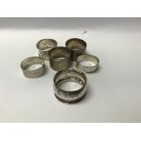 A collection of six silver napkin rings .