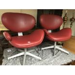 A pair of modern design wide seated single arm eas