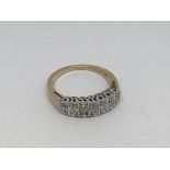 A 9ct gold ring set with 7 diamonds approx 0.33ct.