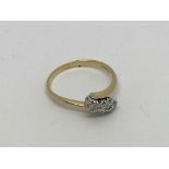An 18ct gold ring set with 3 diamonds approx 0.25c
