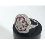 A Victorian style ruby and diamond cluster ring, a