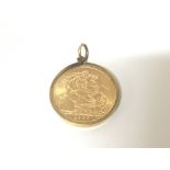 A 1965 gold sovereign in a 9ct gold mount.