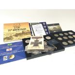 A collection of commemorative coins including 210
