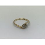An 18ct gold ring set with 2 diamonds approx 0.25c