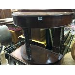 A Victorian mahogany wash stand or bedroom side table of circular shape with a hinged lid.