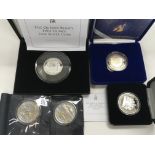 A small collection of silver proof coins.