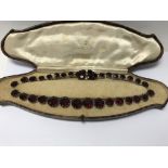 A Christian Dior necklace set with red stones , se