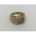 A 9ct gold ring set with a square of 16 diamonds a