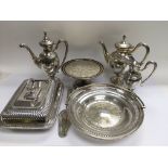 A three piece silver plated tea set, two dishes, a