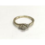 A 9ct gold ring set with a pattern of diamonds, ap