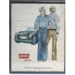 A framed and glazed vintage Levi's jeans advertisi