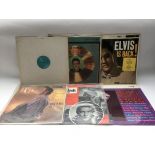 Six Rock n Roll LPs by various artists including Elvis Presley, Buddy Holly and Jerry Lee Lewis.