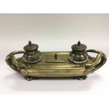 A heavy brass Victorian desk piece with stamp box