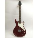 A Line 6 Variax electric guitar in metallic red with a white scratchplate. Serial number 03060239.