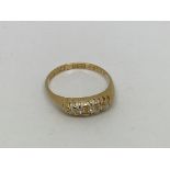 A vintage 18ct gold ring set with 5 diamonds. Size