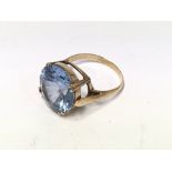 A Gold (Unmarked) and large blue topaz Set ring.