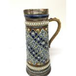 A Lambeth Doulton stoneware jug with raised decora