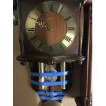 A Hermle wall clock the brass chapter ring with Ro