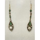 A pair of 1920s style drop earrings set with diamo