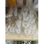 A collection of Stewart crystal including decanter and wine glasses .