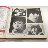 A multiple signed Guiness book of British hit singles containing approx 250 autographs from the