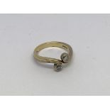 An 18ct gold ring set with 2 diamonds approx 0.33c