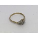 A 9ct gold ring set with 16 small diamonds approx