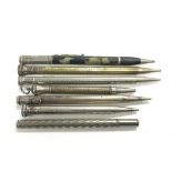 A collection of propelling pencils to include silv