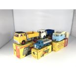 Four Dinky Toys vehicles. Two Bedford TK Tippers #