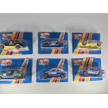 Six Hot Wheels Super toy cars. A Jeep Laredo, a Je