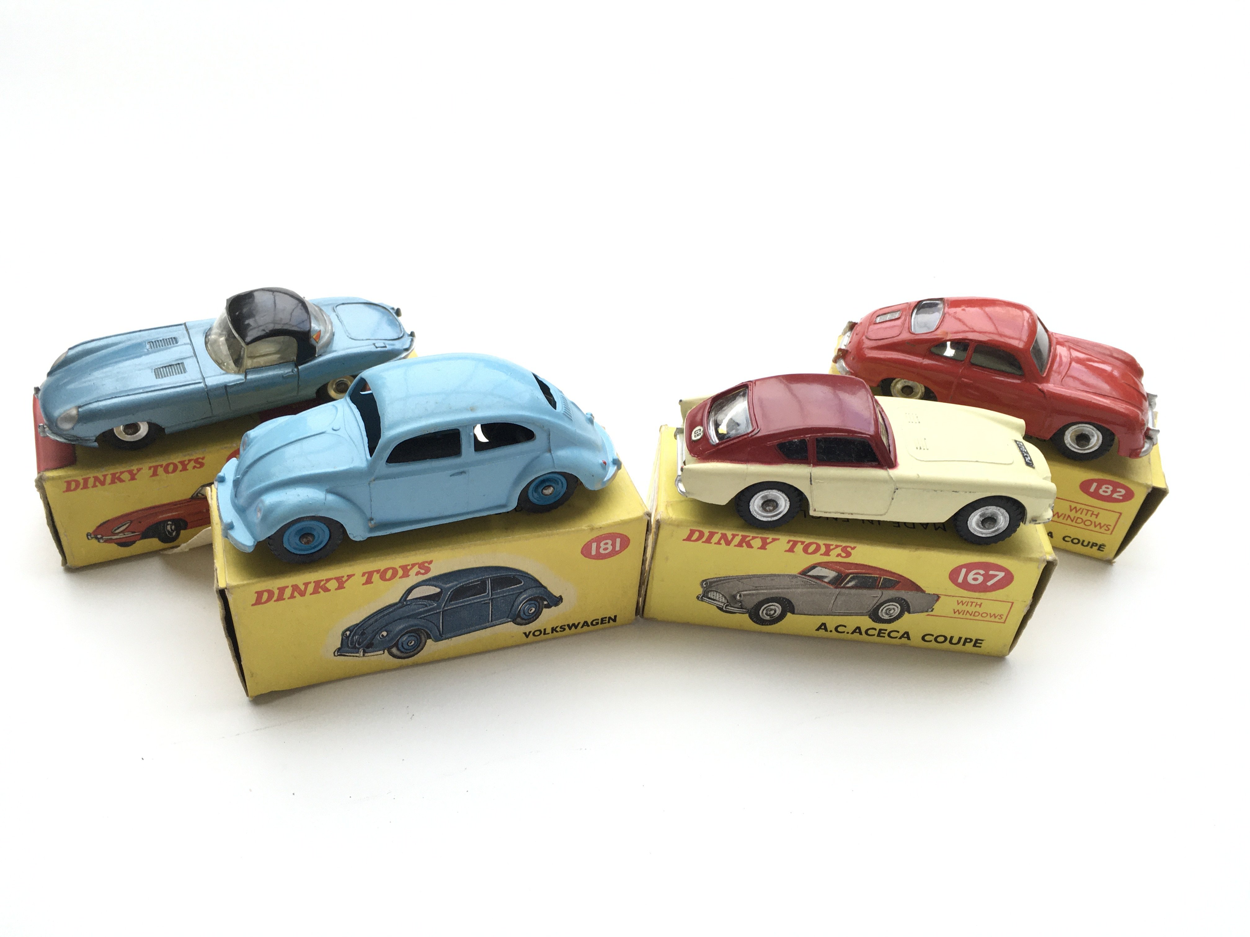 4 Boxed Dinky cars, #120 Jaguar “E” type, #181 Vol