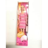 A Barbie Fashion Photo doll, a Barbie Princess,A Barbie pearl beach and a Barbie Zig Zag. All