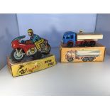 An OMI Winner '93 friction powered motorcycle & a